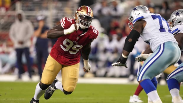 San Francisco 49ers defensive tackle Javon Kinlaw (99) rushes against Dallas Cowboys offensive tackle Tyron Smith (left) during the fourth quarter at Levi's Stadium. Mandatory Credit: Darren Yamashita-USA TODAY Sports